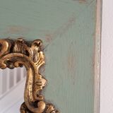 Miroir ancien de style Louis XV en bois et stuc doré.