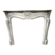 Louis XV style fireplace in veined white marble, 20th century.