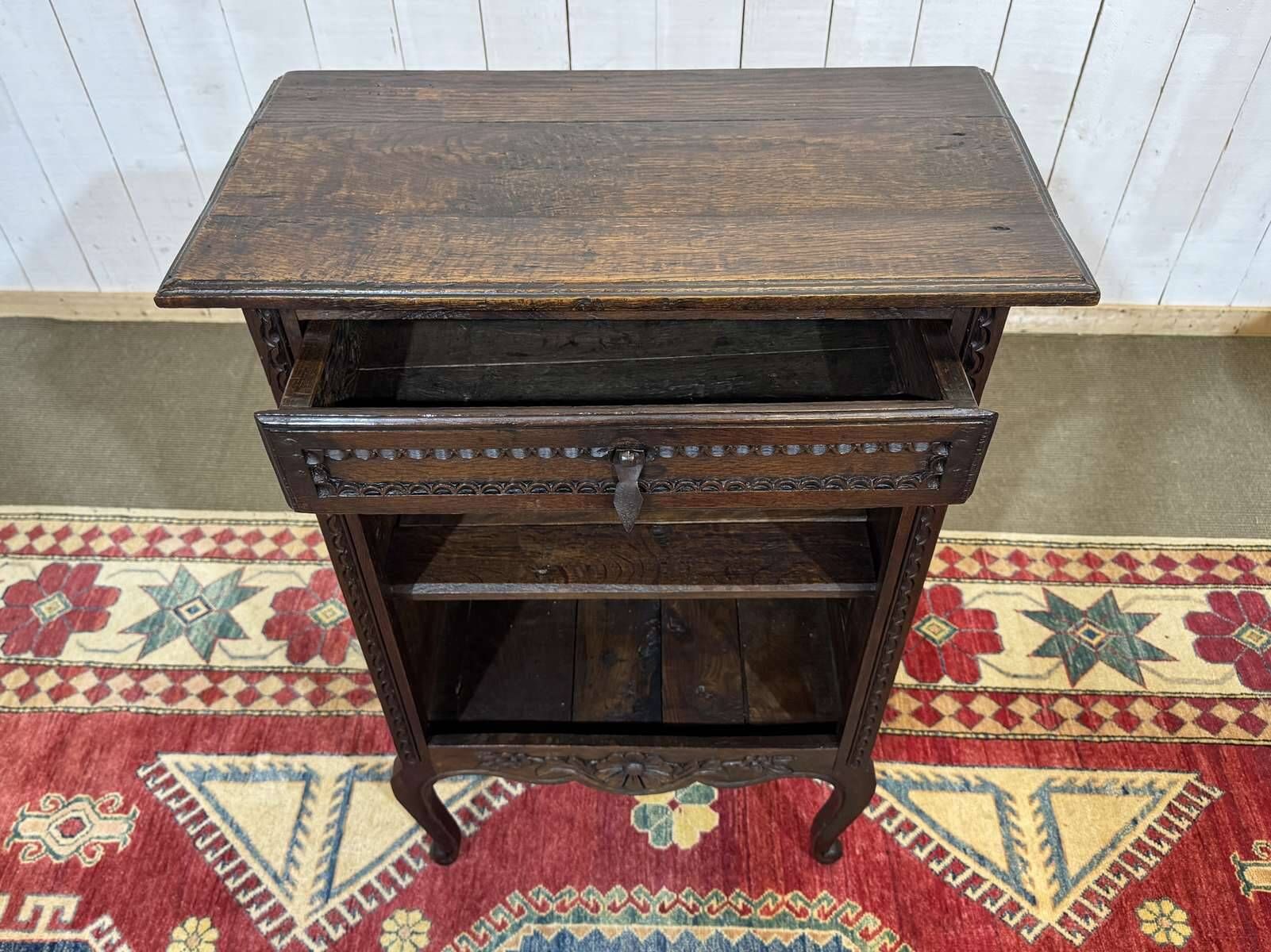 Oak accent furniture bookshelf with a drawer, early 20th century work.