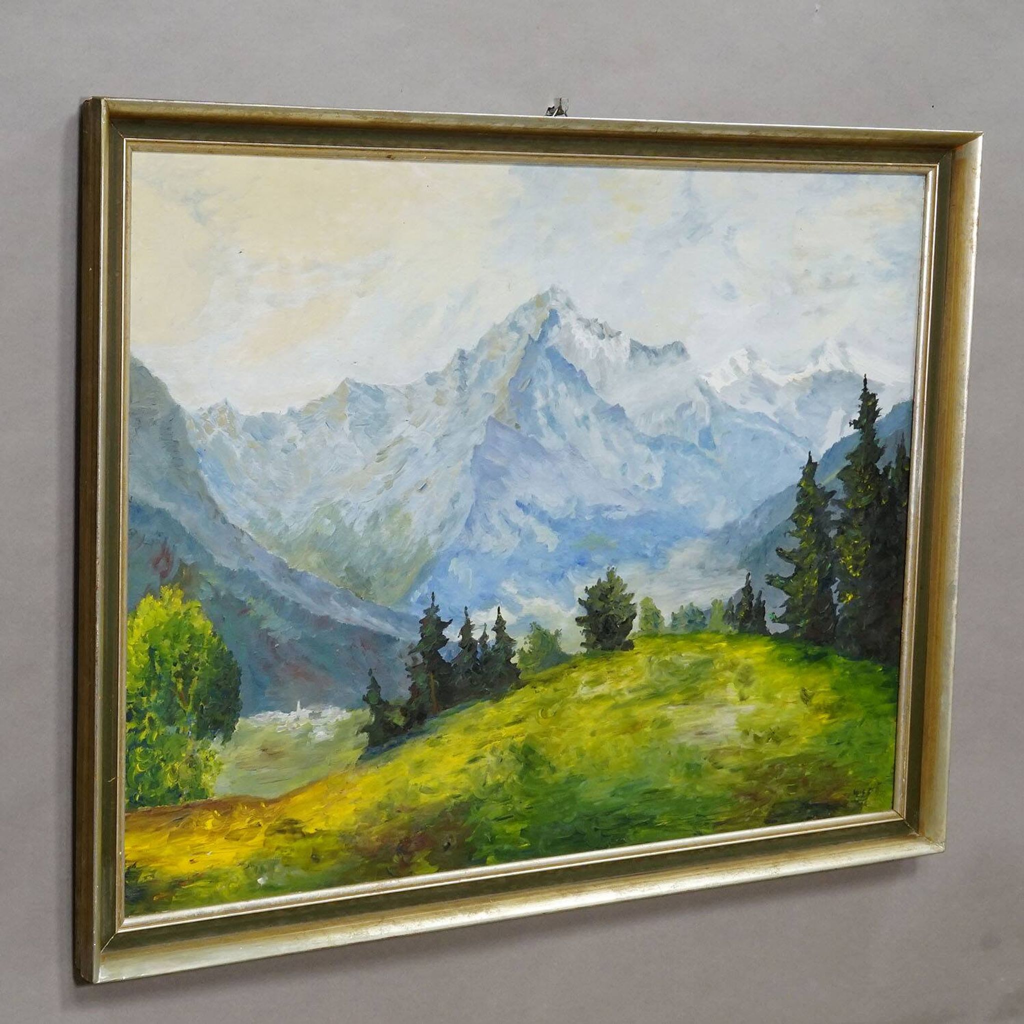 Alpine landscape painting with meadow, trees, and mountains.