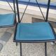 5 Bella folding chairs in steel and petrol blue leather by Maison Cattelan