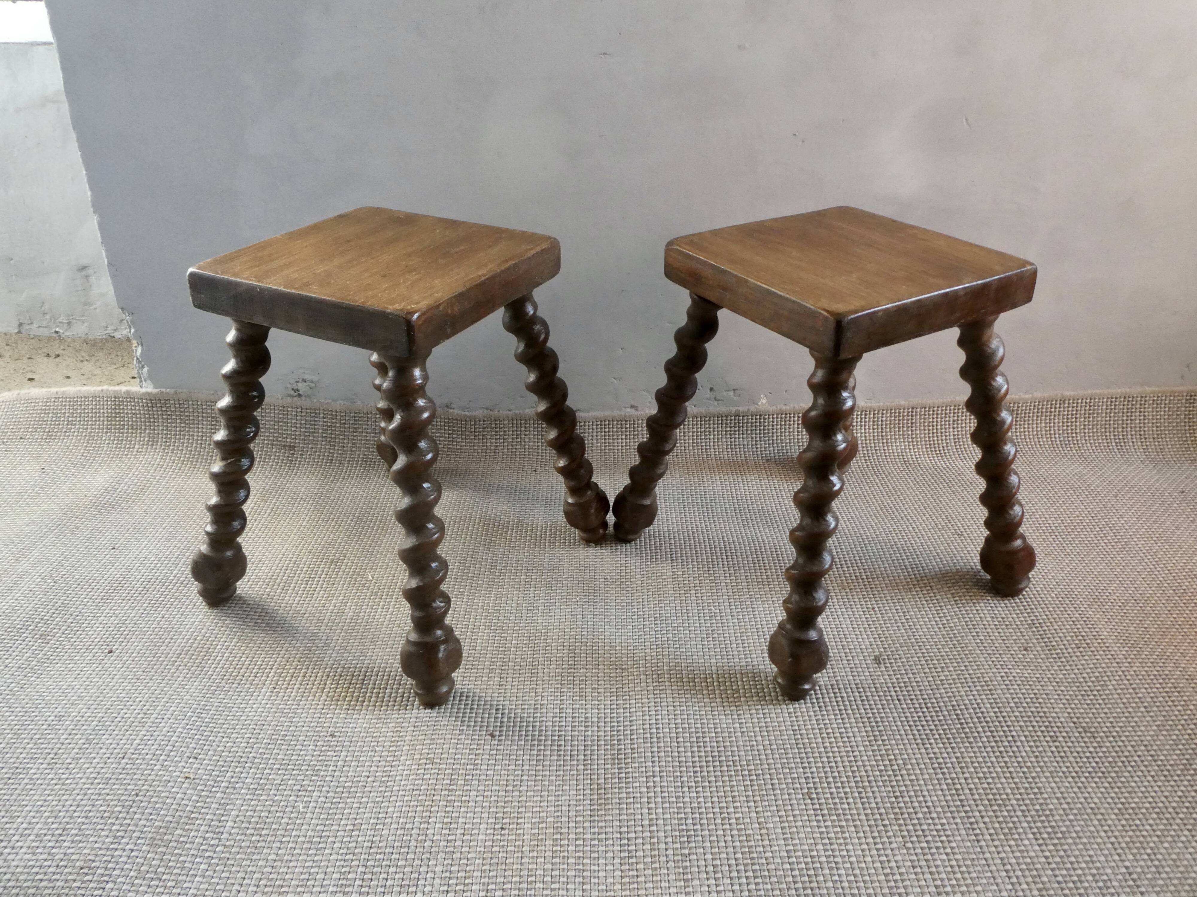 Pair of solid wood stools, carved legs