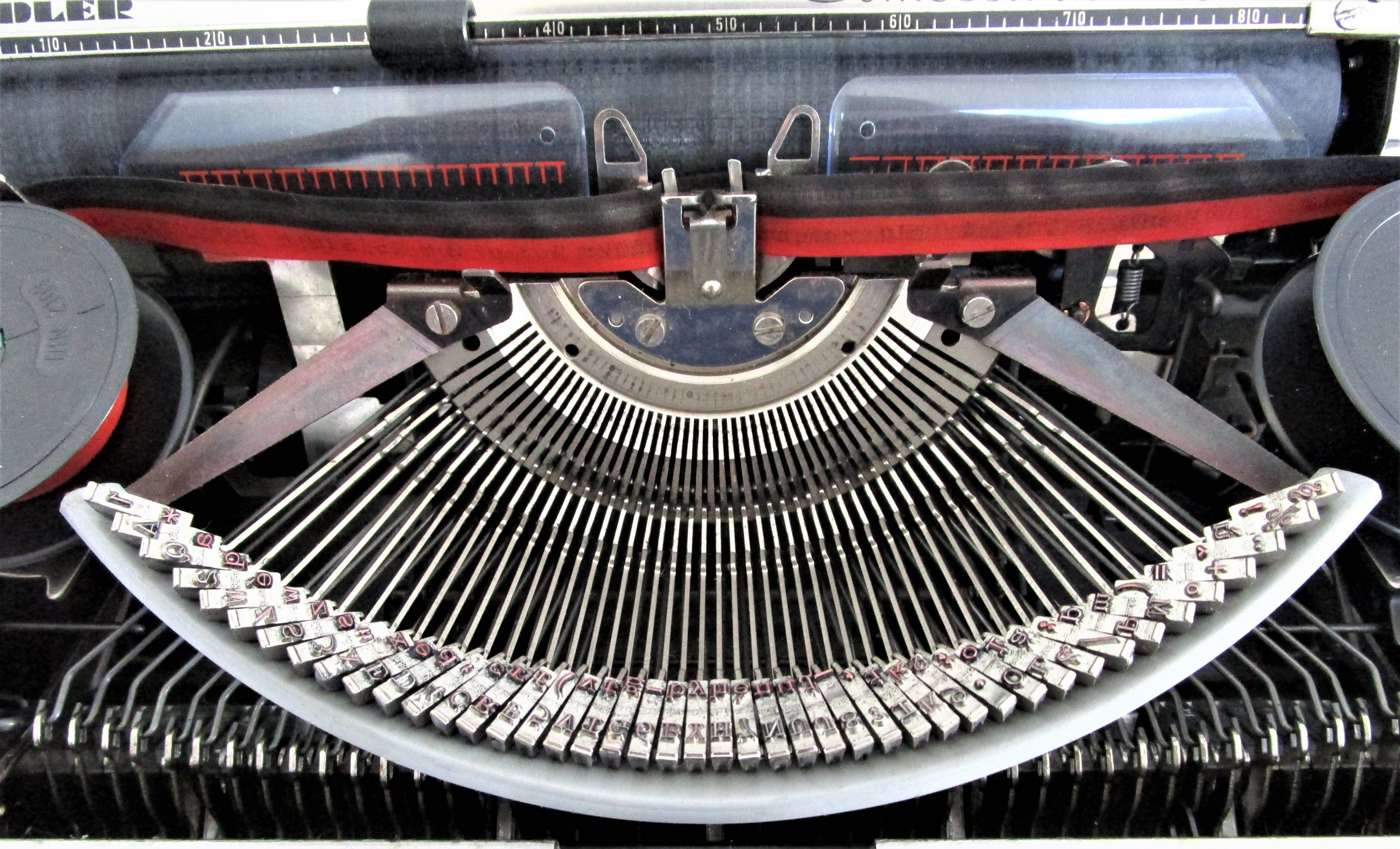 Writers' typewriters of light grey 70s Adler made in Holland
