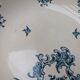 Shallow round plate Boch Frères model Regent with arabesque and foliage decoration.