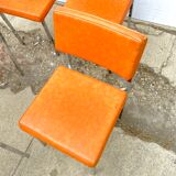 Series of 4 retro chairs in imitation orange leather MCA K6 - chrome tube structure