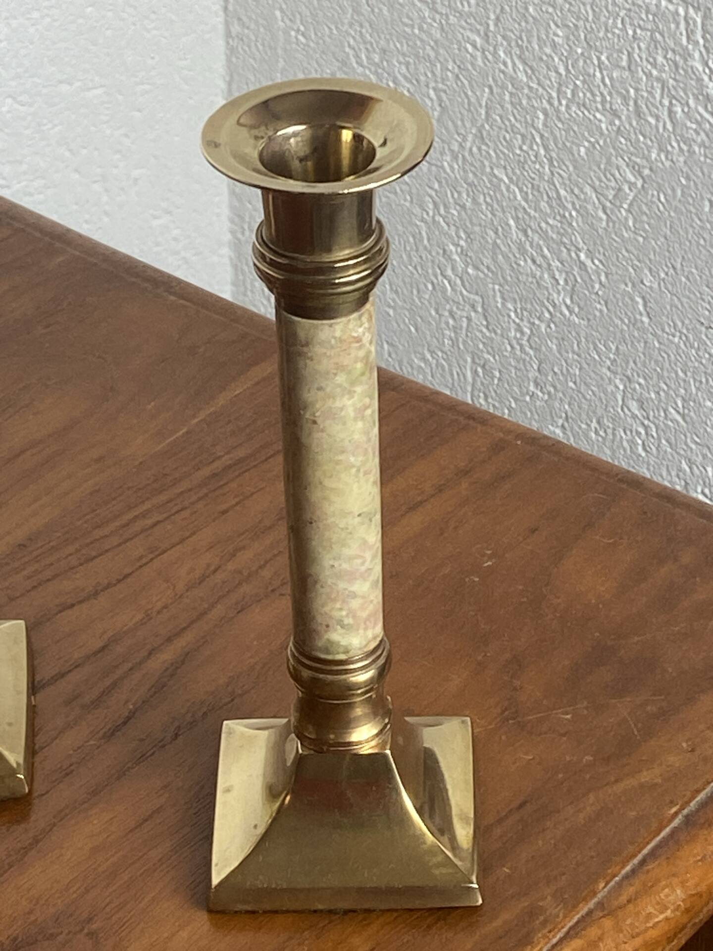 Pair of brass and stone candlesticks