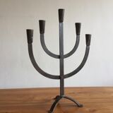 Old iron candelabra shaped high time