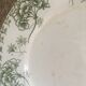 Flat old plates mismatched with flowers