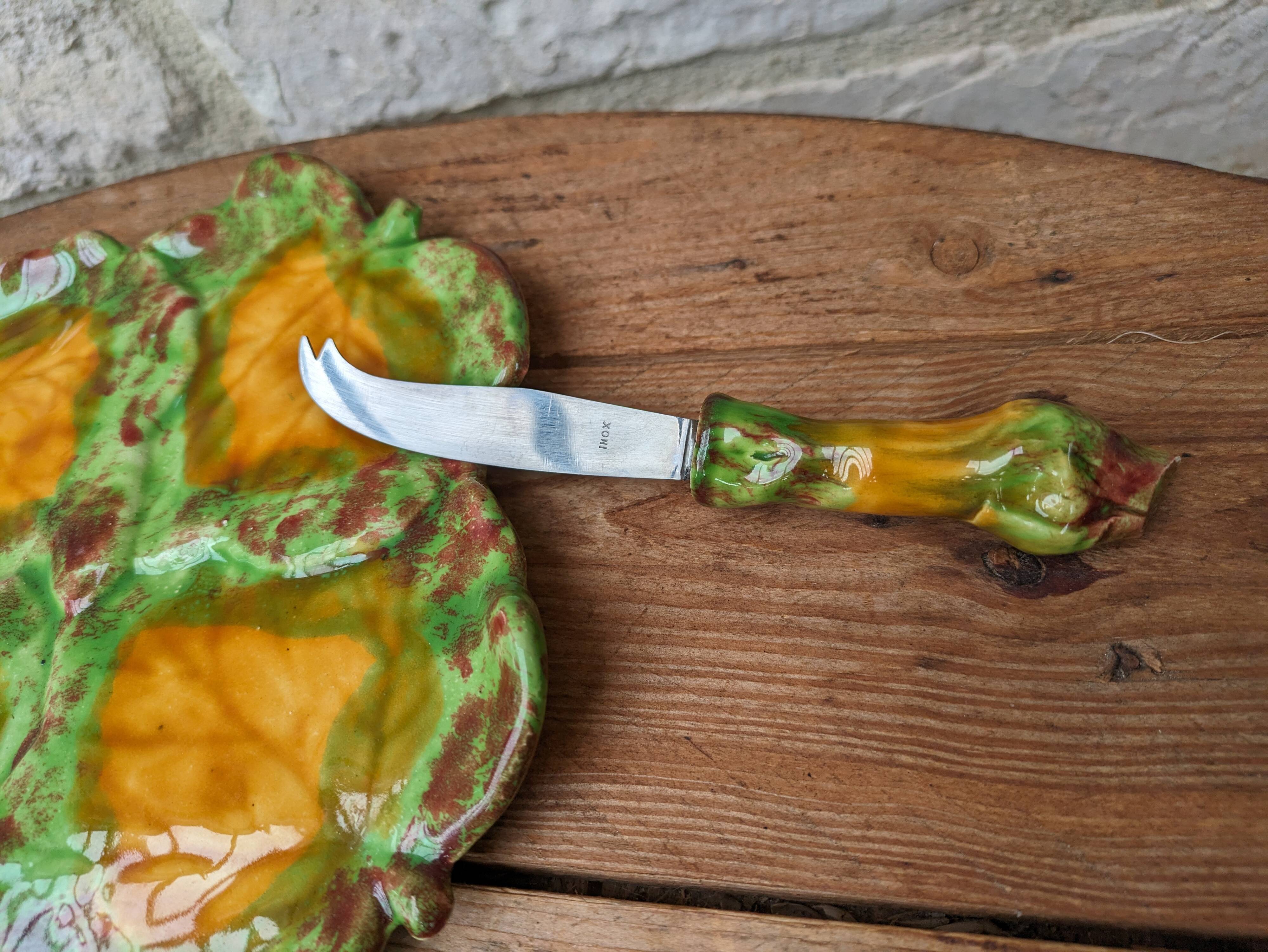 Antique colored ceramic cheese plate with knife