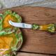 Antique colored ceramic cheese plate with knife