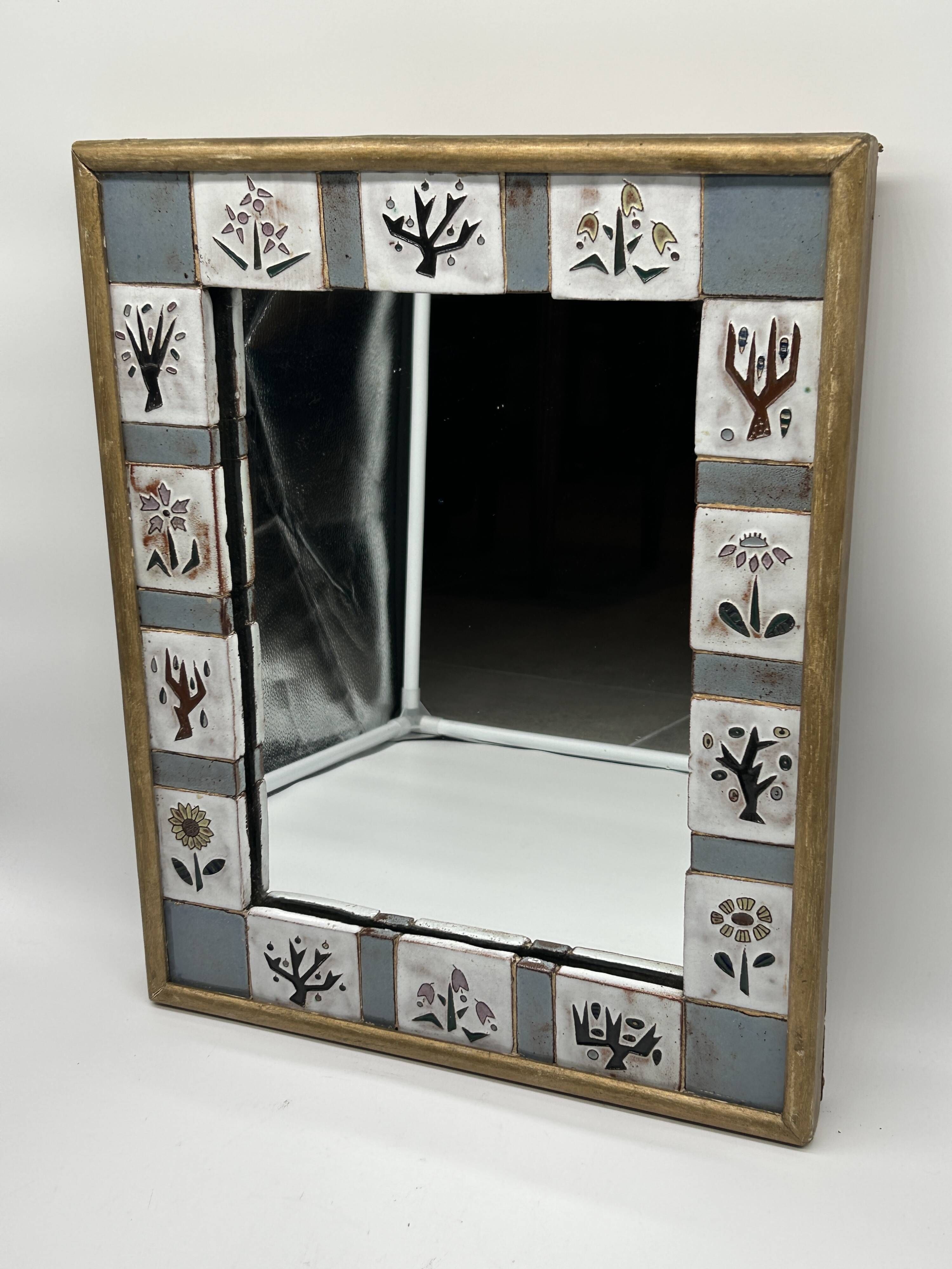 Ceramic enamelled mirror in the style of Odette Dijeux.