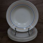 6 old cream-coloured deep plates with blue/orange trim.