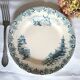 Mismatched antique flat plates made of ironstone pottery.