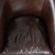 Dark cow leather club armchair with a stylish design in English style