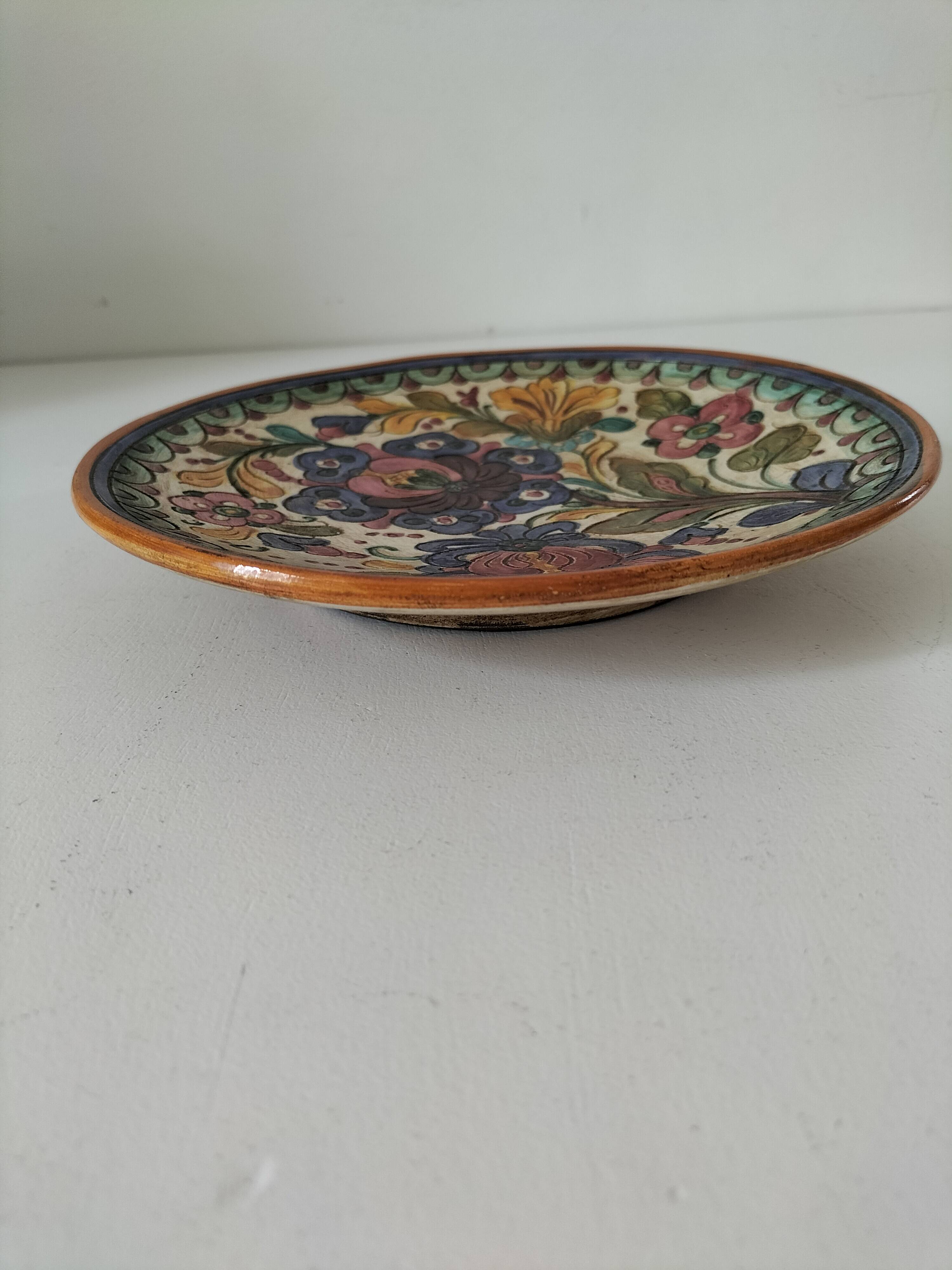 Spanish earthenware plate, hand-painted floral decoration.