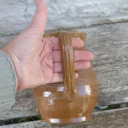 Old stoneware wine jug with patterns