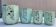 Set of 4 Art Deco celadon green and silver barbotine pots.