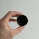 Set of 5 dark brown glazed ceramic egg cups.