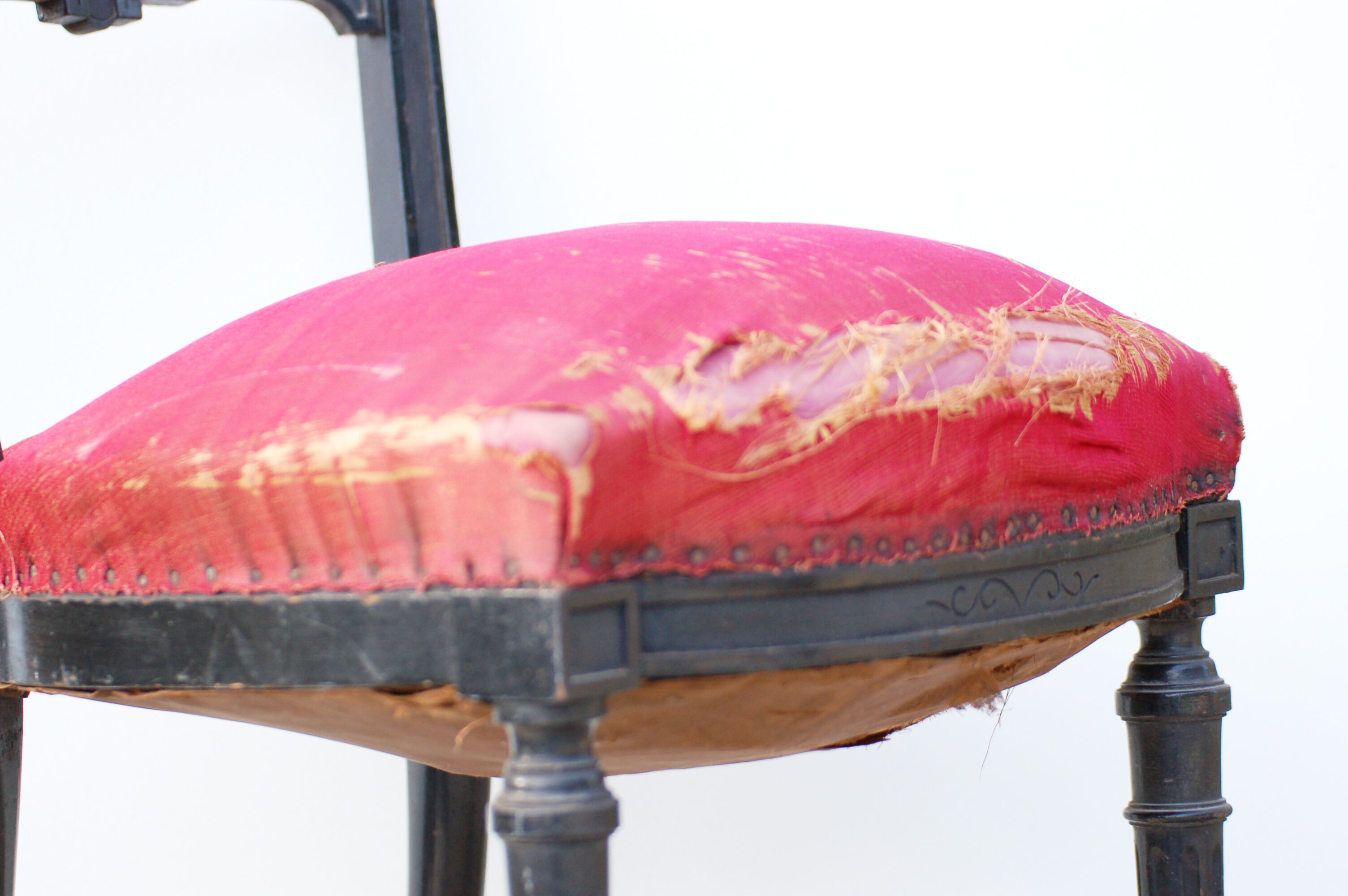 Pair of old black wooden chairs and Red seat.