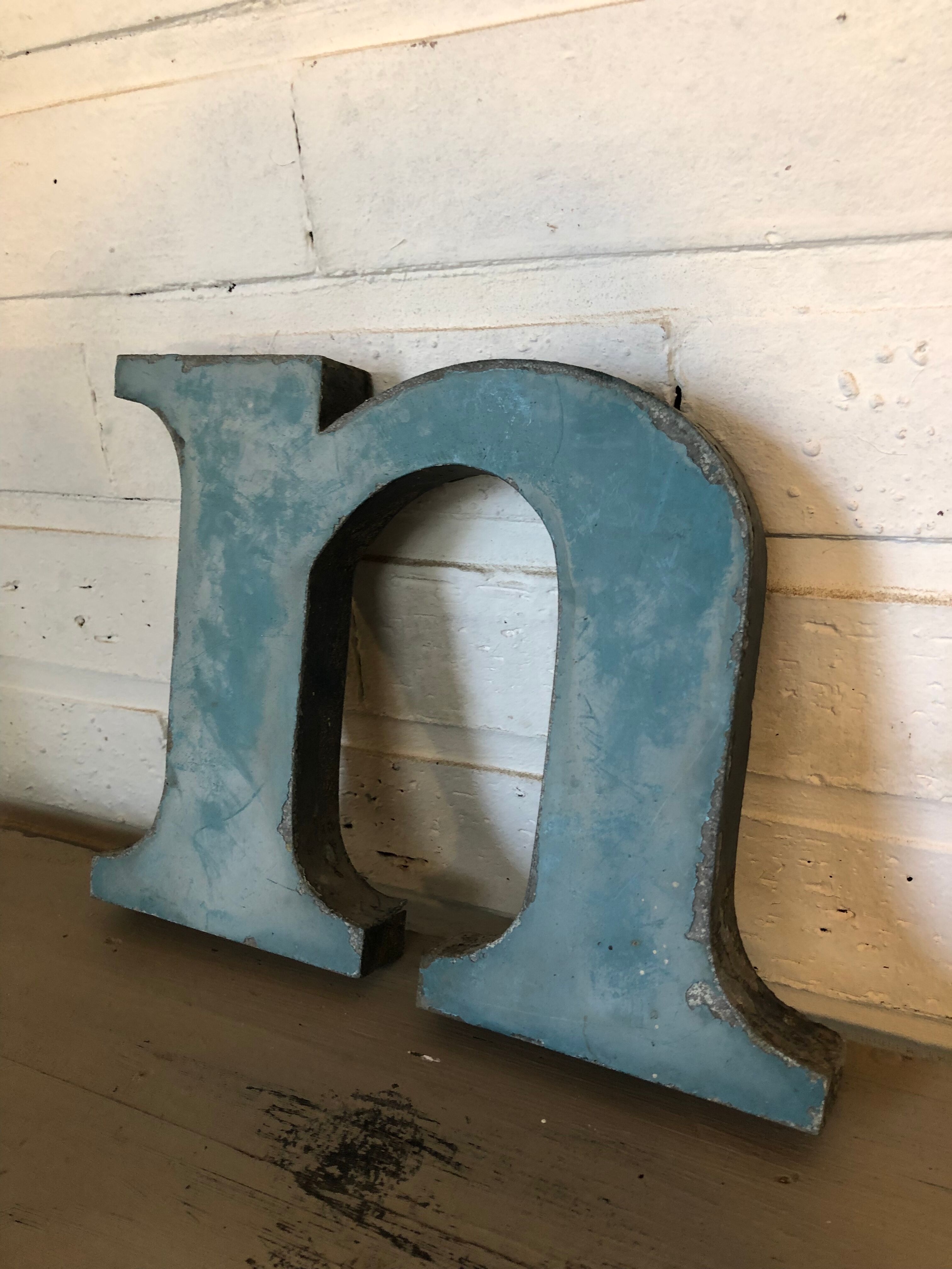 Blue metal letter "N"