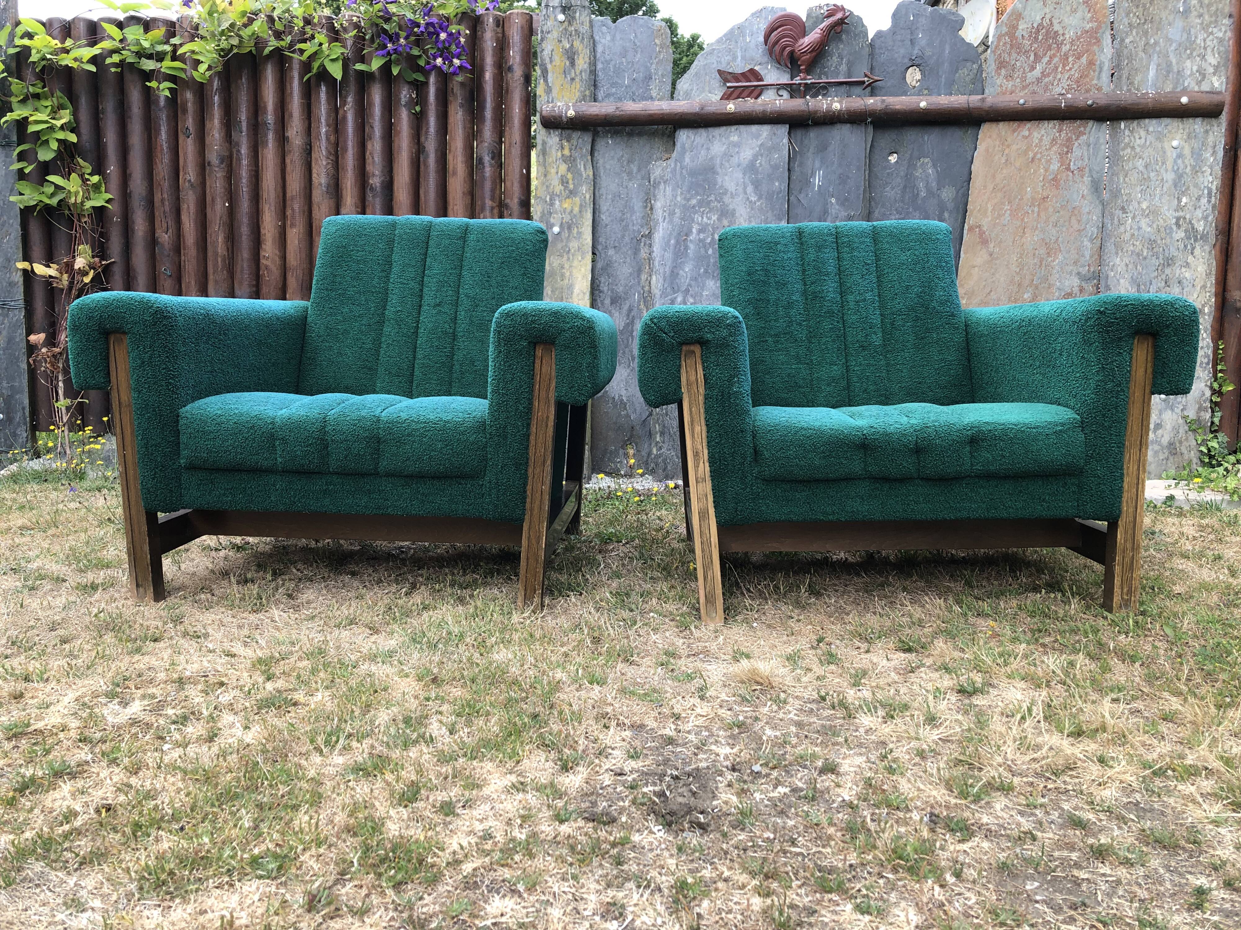 Duo of vintage armchairs with green fabrics.