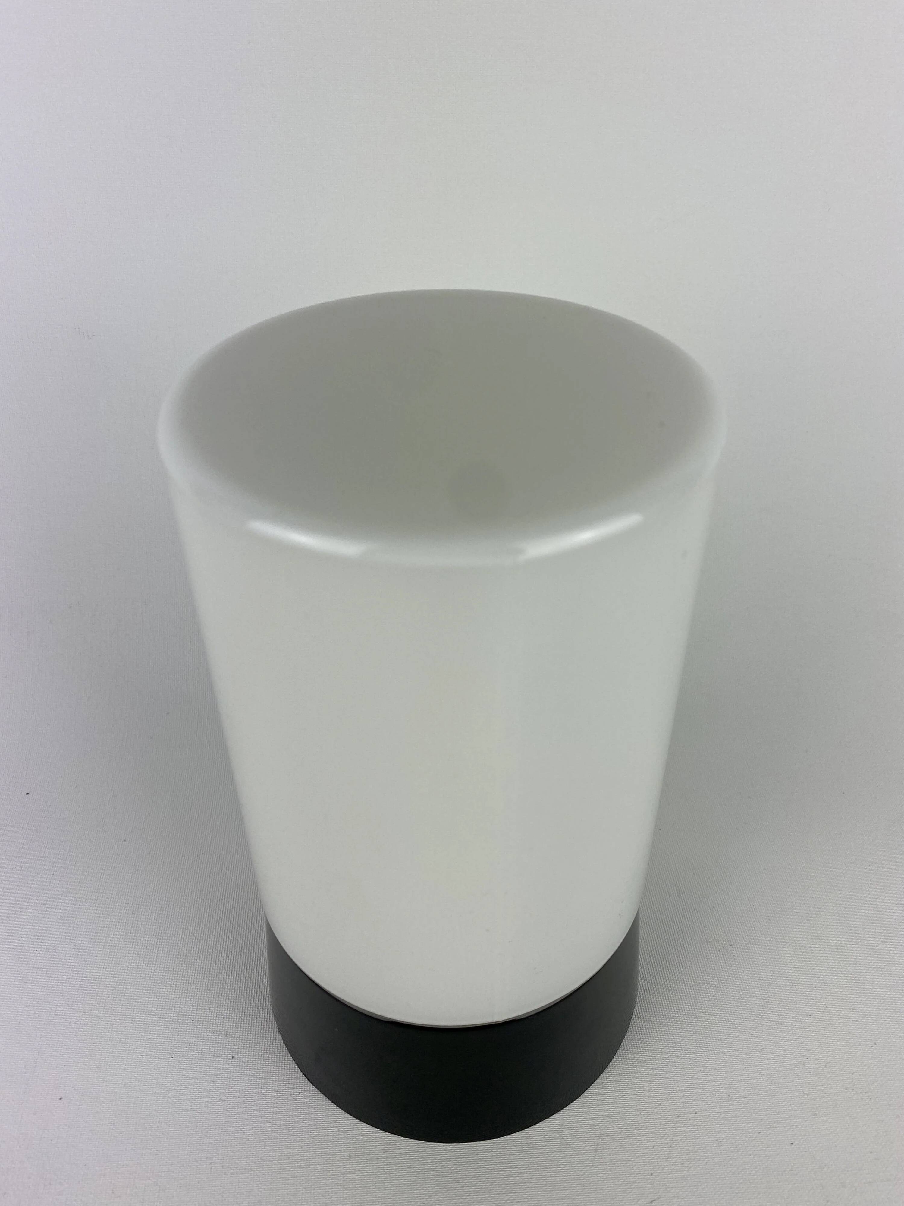 White cylindrical Art Deco chandelier RAAK with black support.