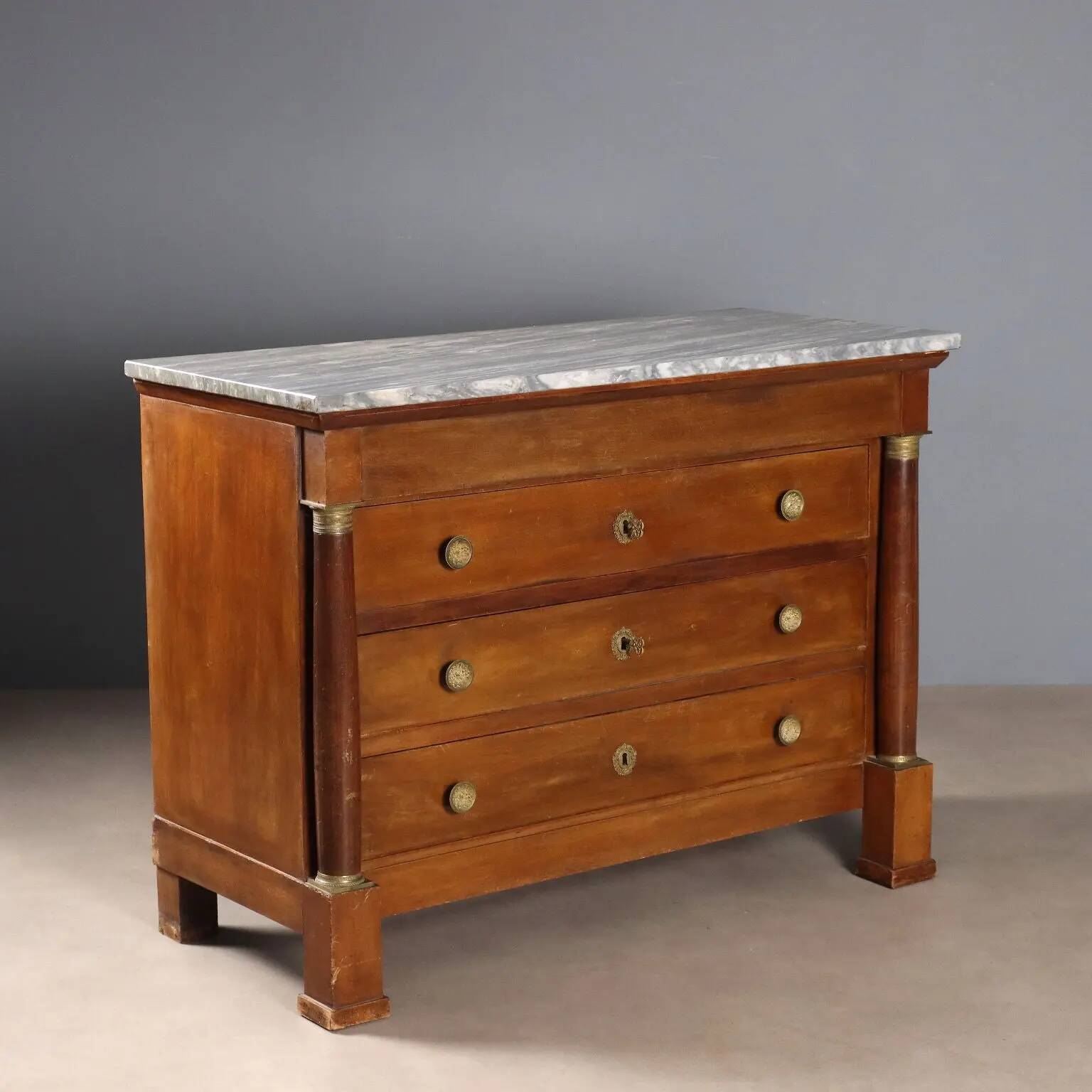 Antique Empire walnut and marble commode, 19th century.