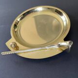 Round brass pocket tray with club and golf ball decoration.