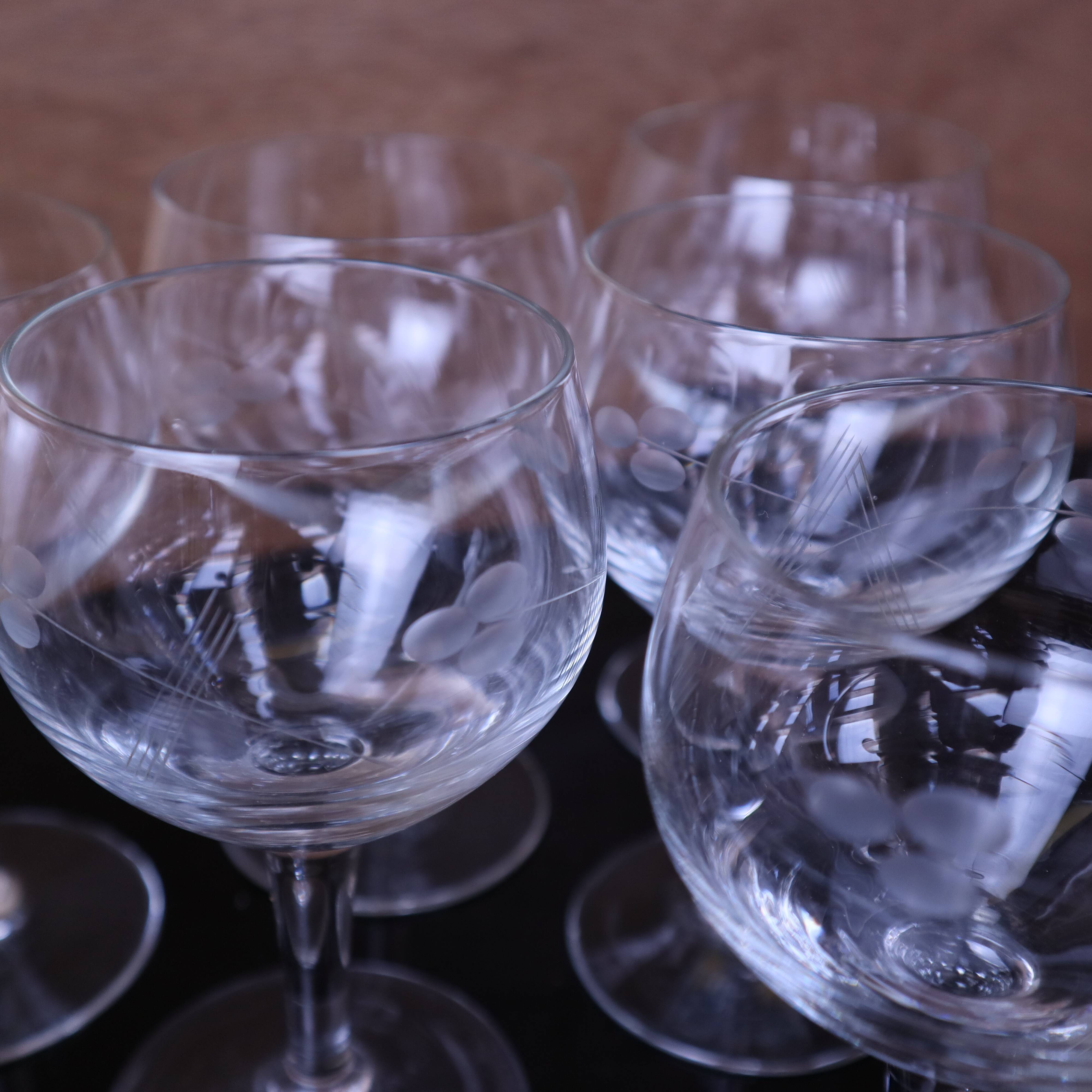 Set of engraved vintage flower balloon red wine glasses.