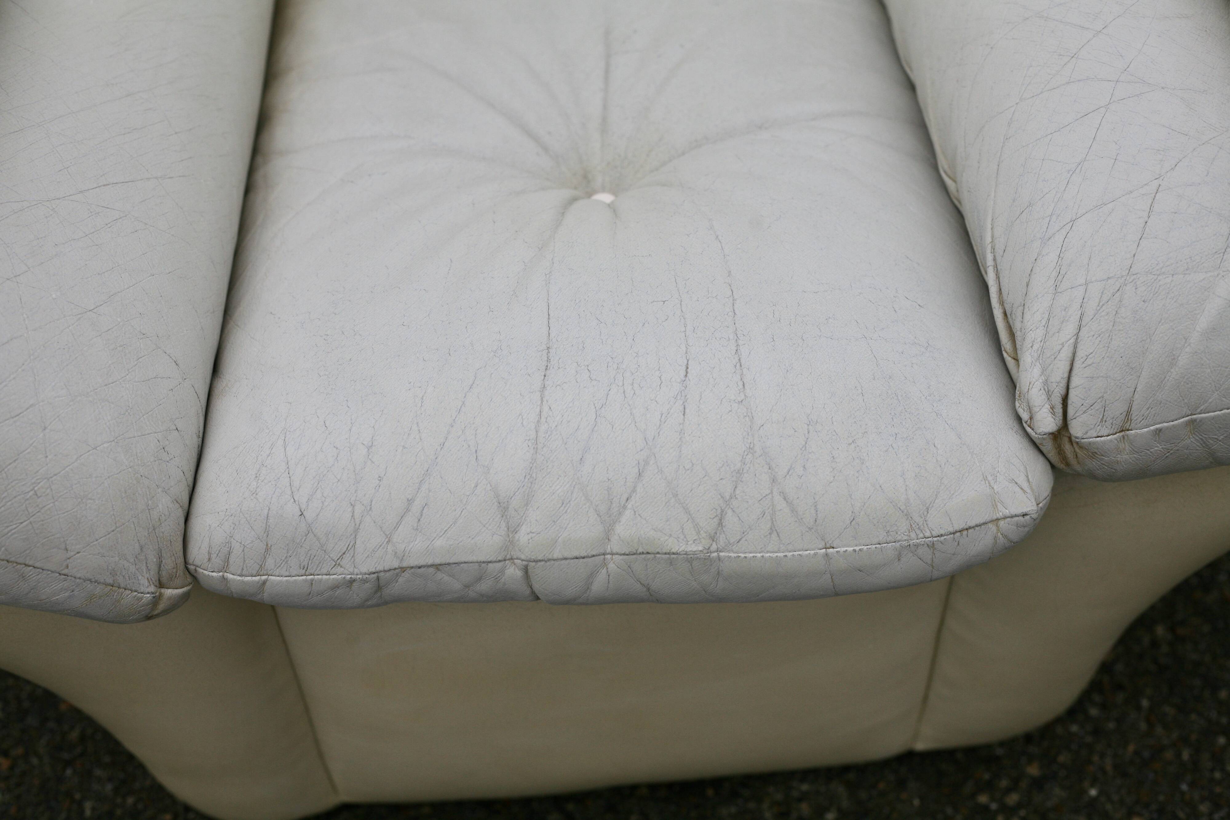Pair of leather “space age” armchairs. Cream colour". Circa 1970.