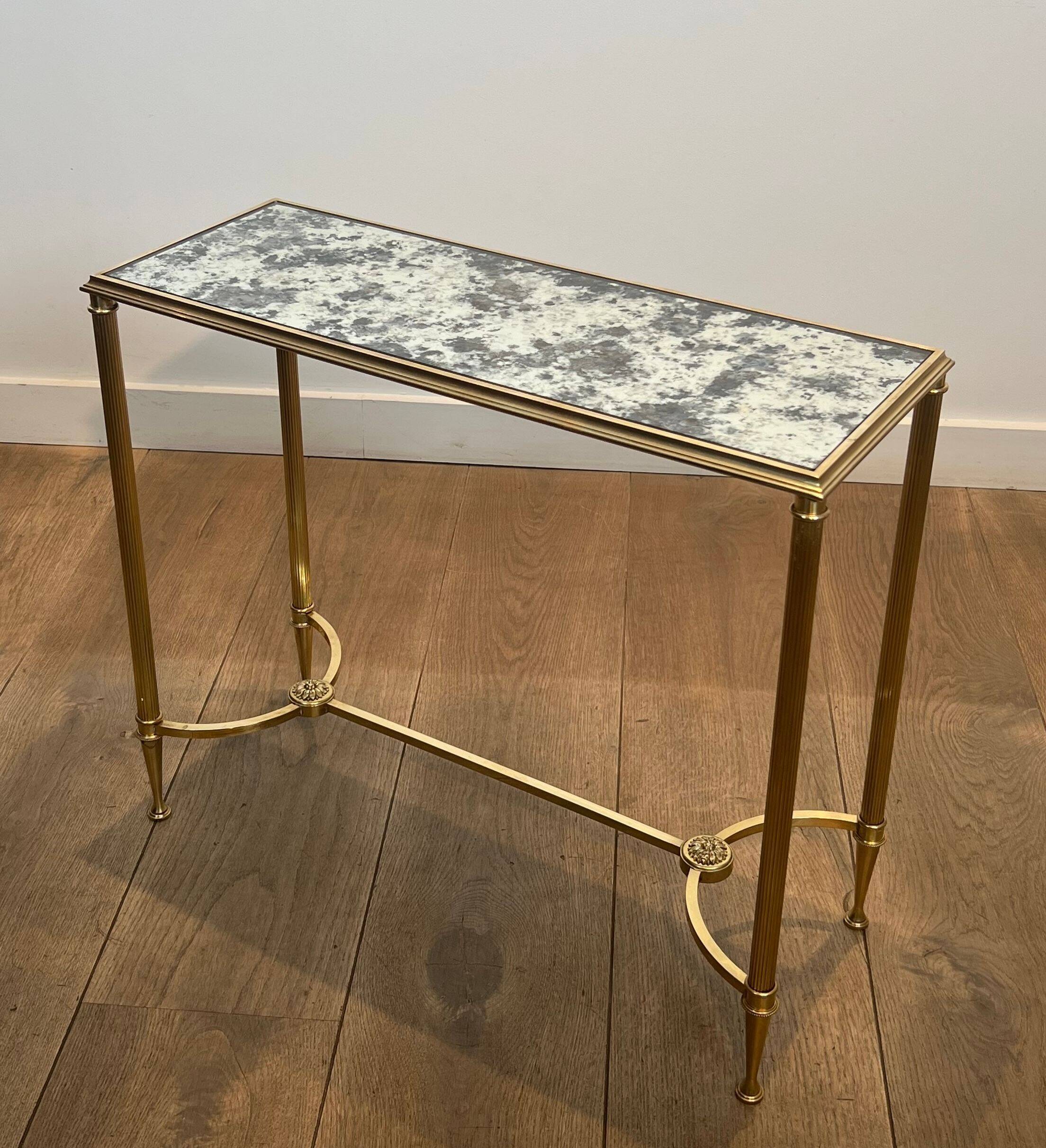 Pair of brass and antique mirror side tables from the Baguès house.