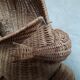 Frog in rattan magazine holder