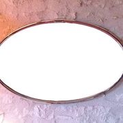 Oval Art Deco mirror with vintage chrome frame from the 1970s.