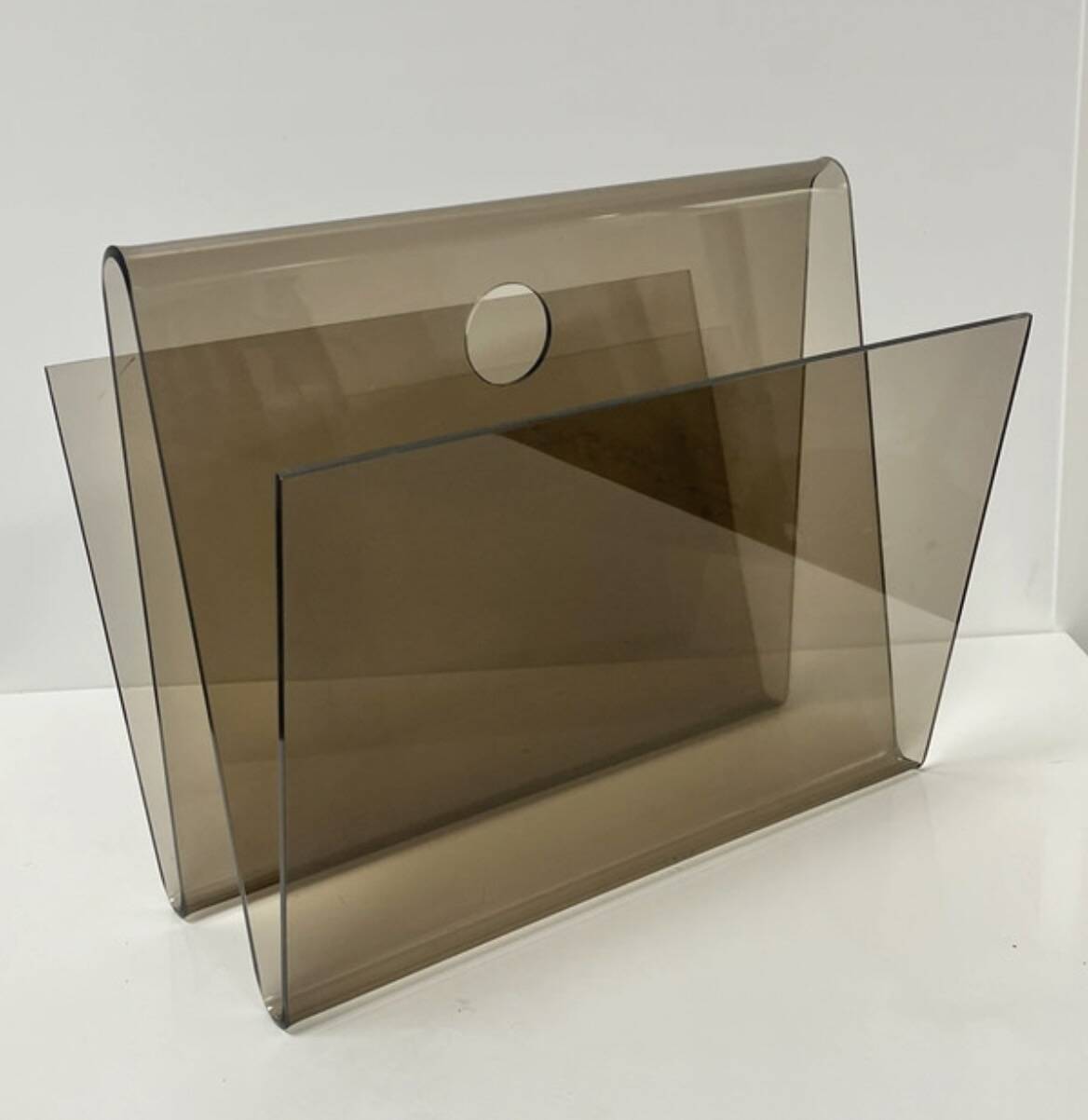 Smoked plexiglass magazine rack in the style of Michel Dumas, France, 1970s.