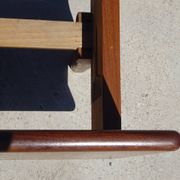 Vintage bed in teak with integrated bedside table.