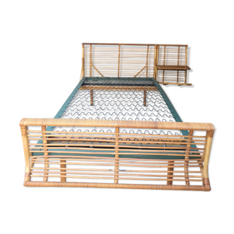 Vintage rattan bed with built-in bedside