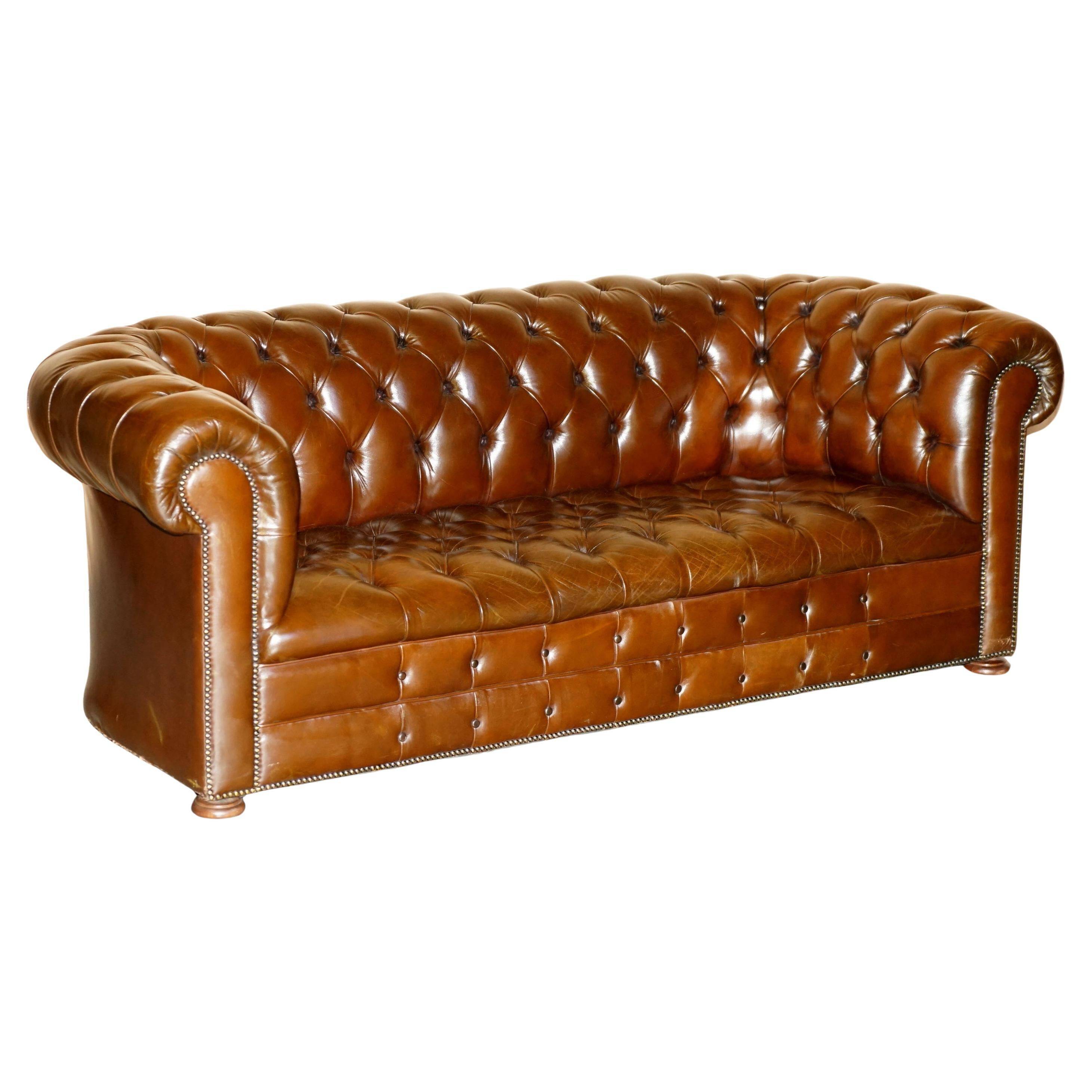 Restored Chesterfield leather sofa in vintage Art Deco style