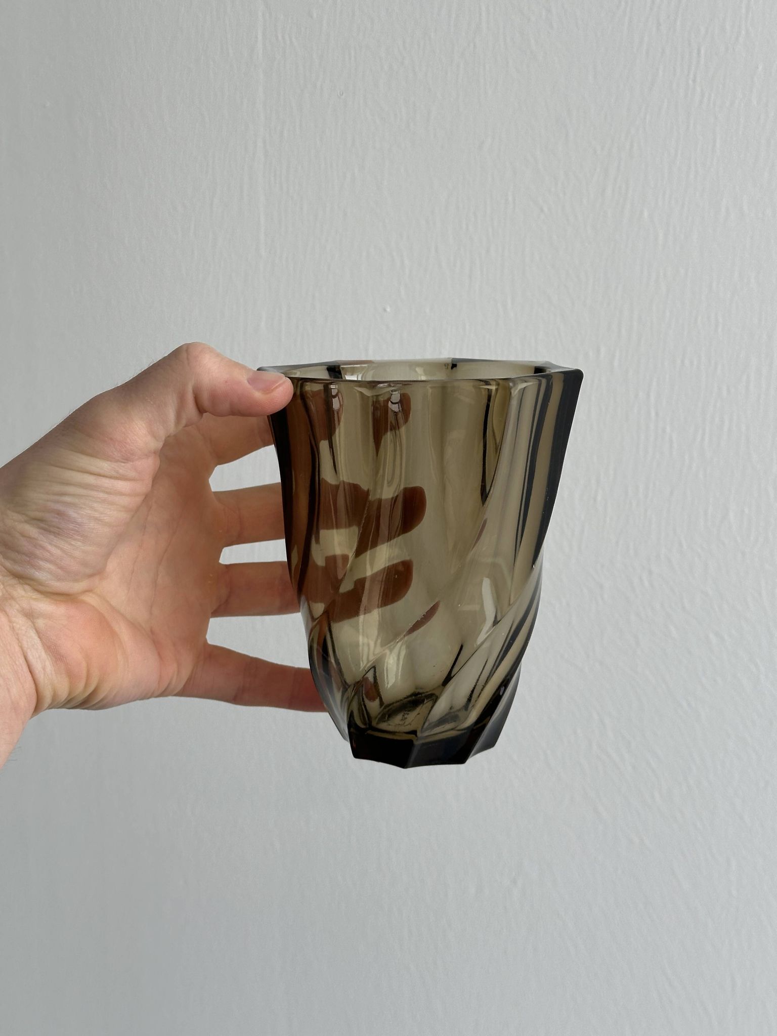 Smoked glass vase with twisted design