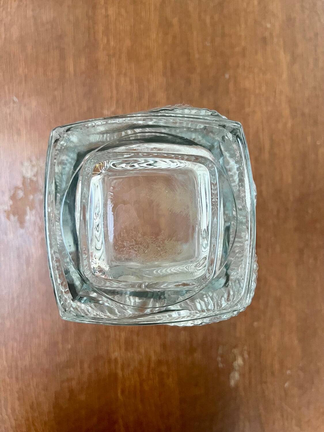 Large moulded glass vase with a floral design