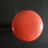 Metal coat rack with 2 red hooks