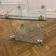 Glass side table with gold decorations.