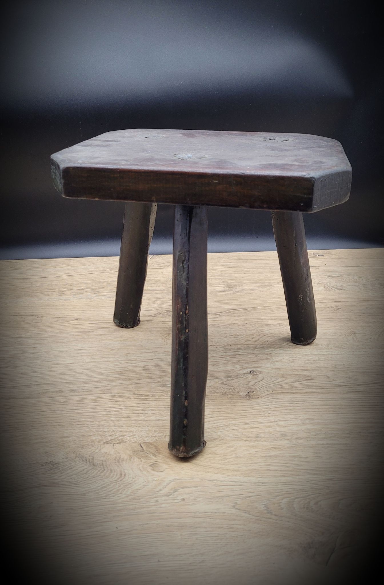 Dark octagon tripod stool