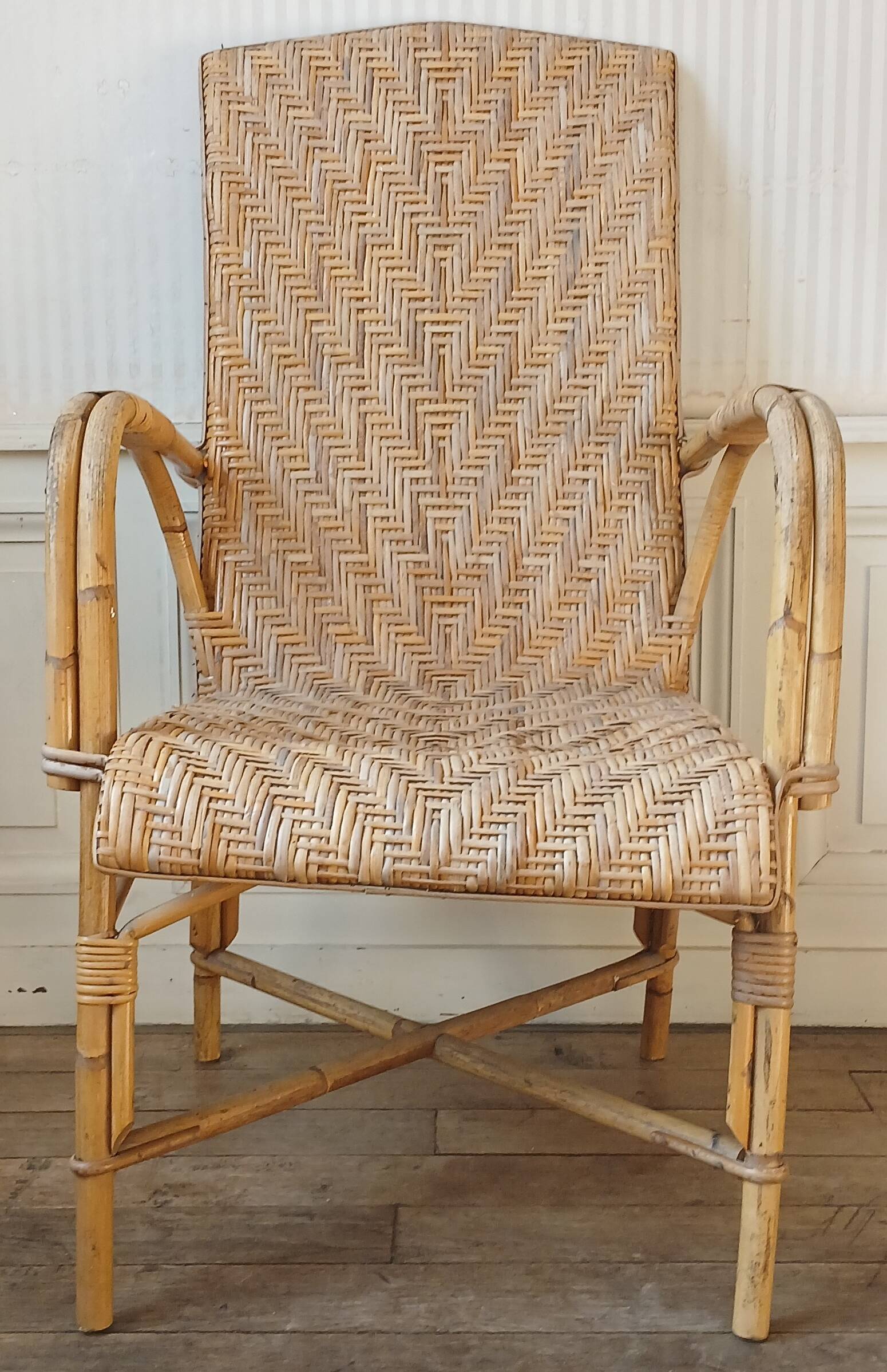High-backed adult rattan armchair, circa 1960