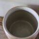 Vase terracotta milk jug with a glazed interior handle.