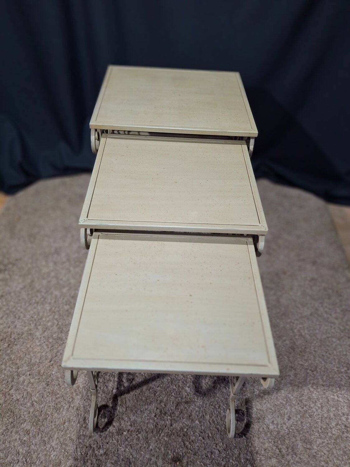 Nesting tables in patinated iron.