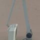 WALDMANN articulated workshop lamp with two industrial clamp arms for architects.