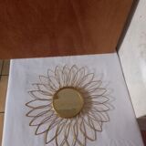 Sun mirror in gilded metal