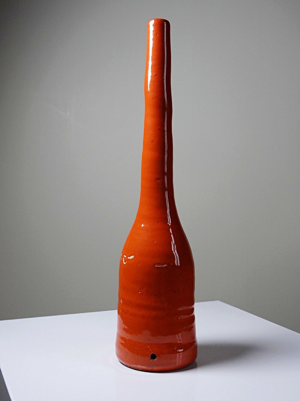 Bright orange mid-century decorative bottle lamp base glazed pottery.