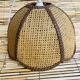 Bohemian suspension in braided raffia and brown fabric