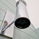 Pair of tubular chrome-plated metal wall sconces, 1970s